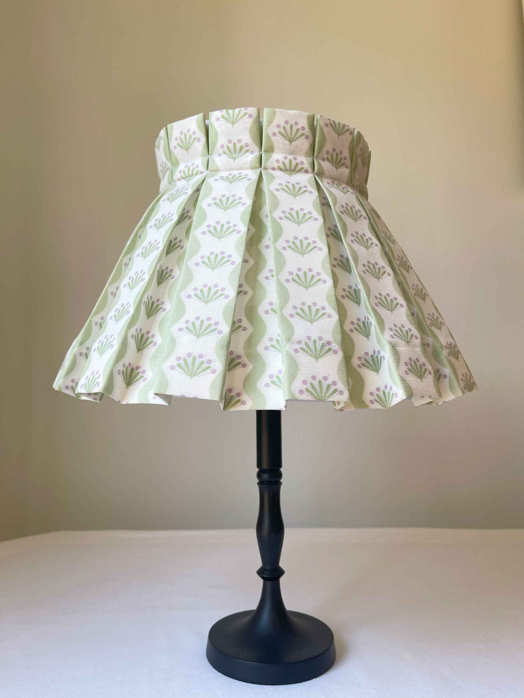Soft green lampshade on a table lamp sits beautifully on the table