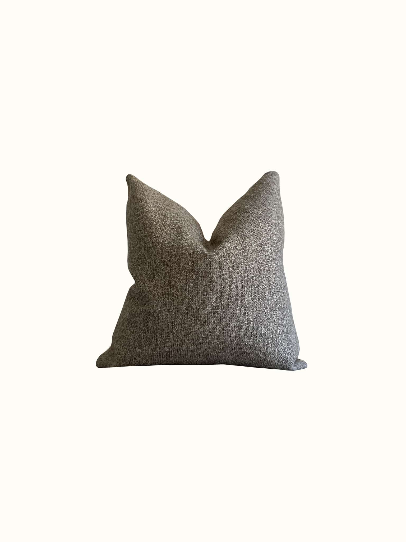 A boucle throw pillow in walnut, earthy brown color is made of thick and durable fabrics at Cielle Home