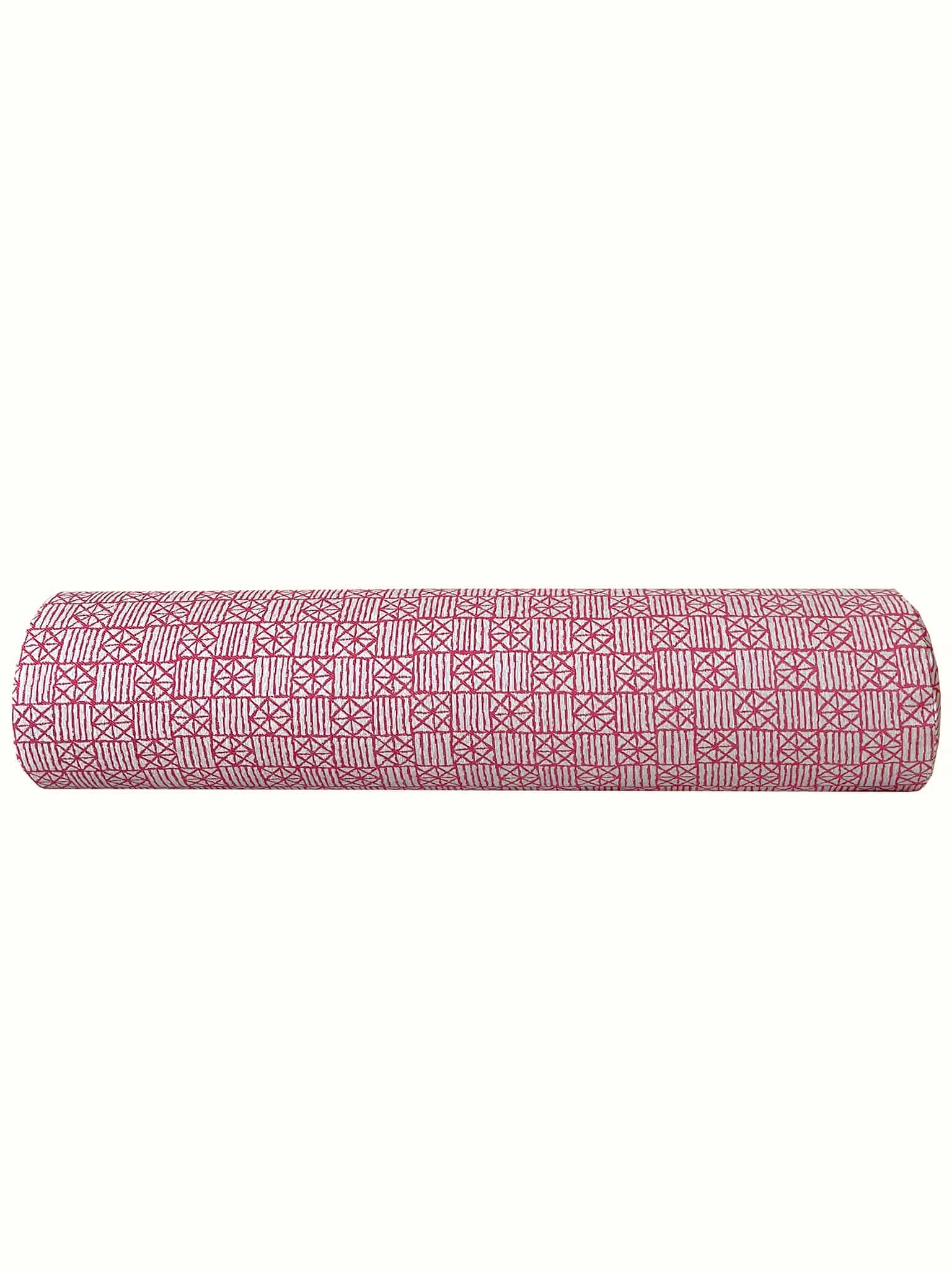 Geometrically patterned bolster pillow in red gives a modern flair at Cielle Home