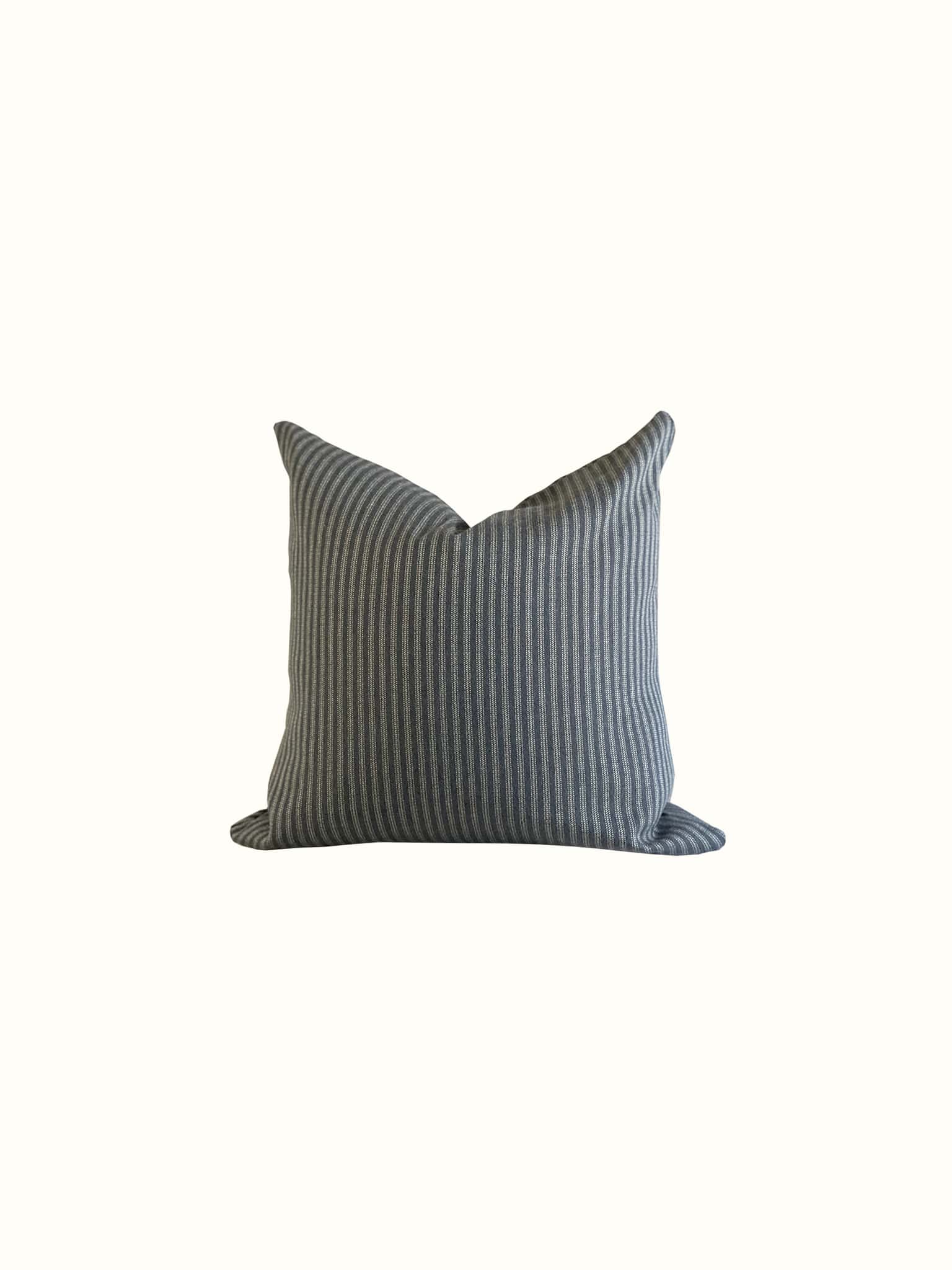 A black and dark grey looking pillow with classic ticking stripes design at Cielle Home