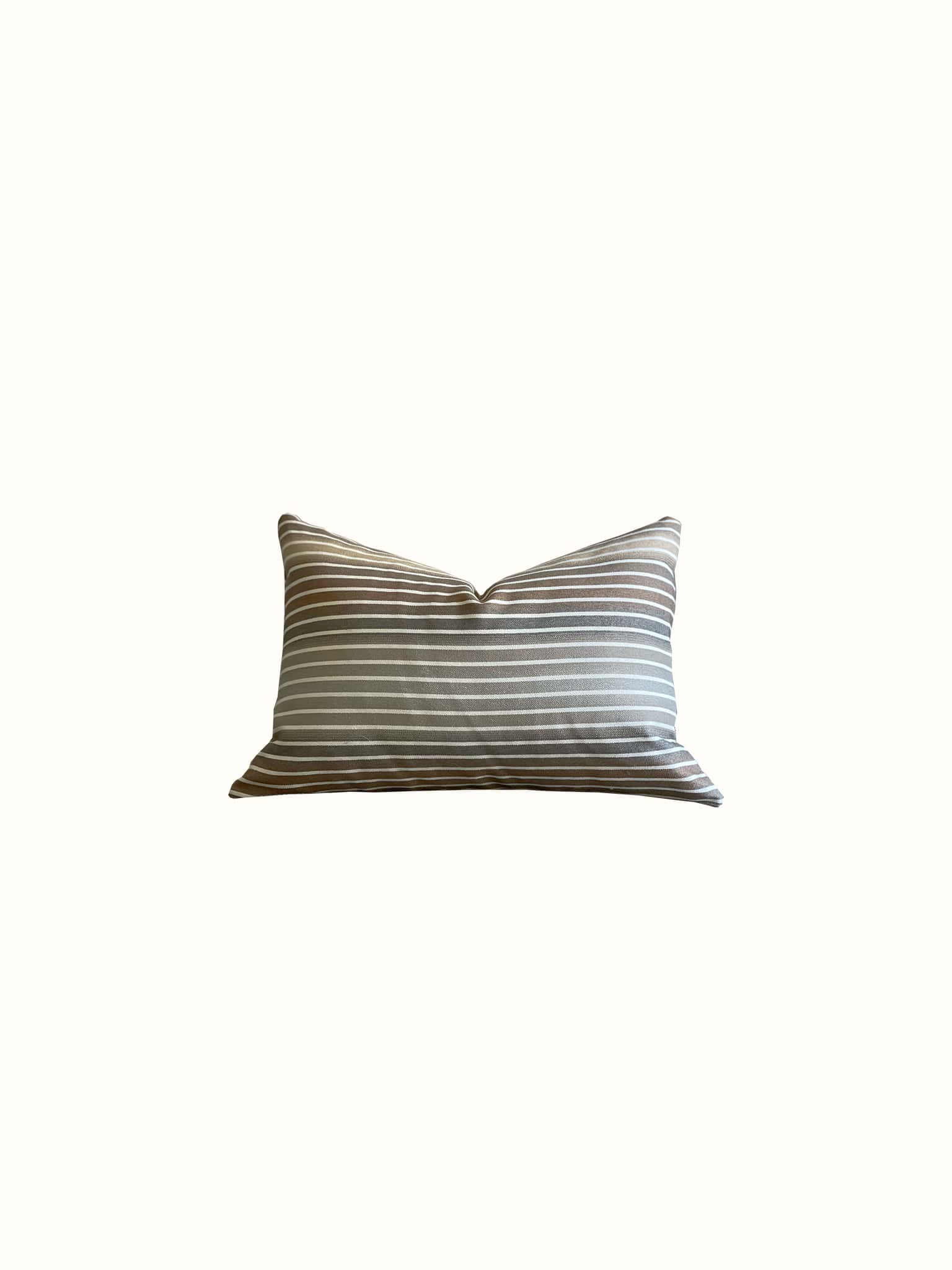 A striped lumbar pillow in brown earthy toned gradience pattern gives an ultimate modern flair at Cielle Home