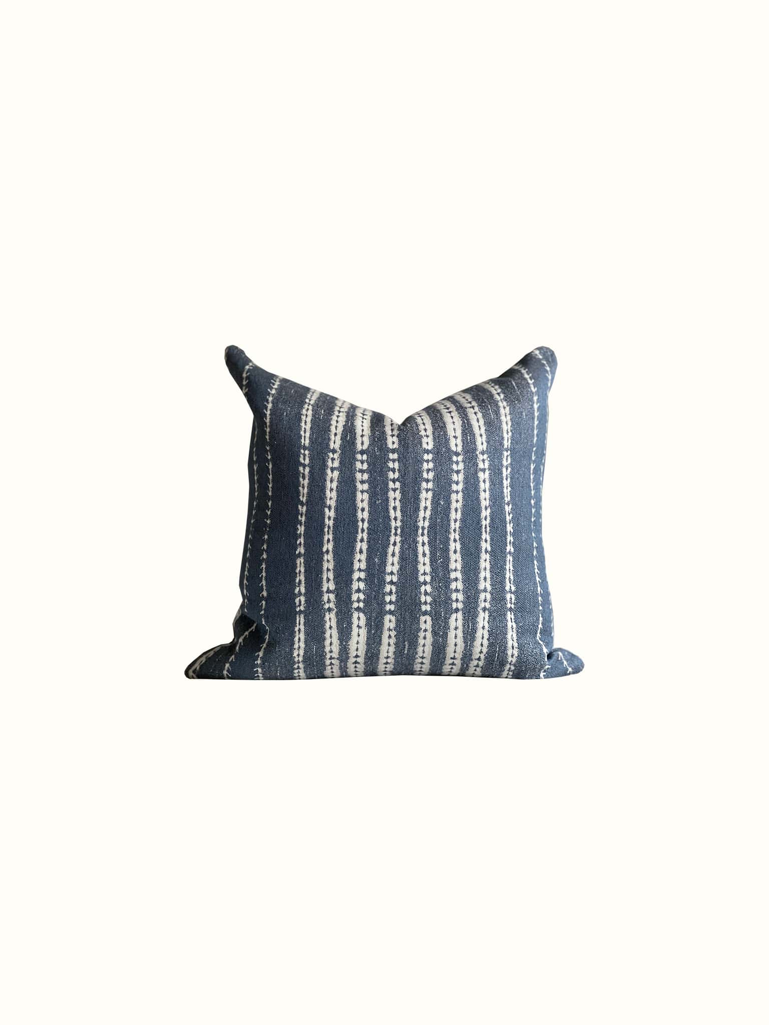 Classic white and blue striped throw pillow in unbalanced design adds a modern twist at Cielle Home