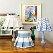 lampshades in various blue hues in the living room console table
