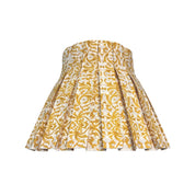 Yellow floral patterned decorative lampshade skirt on a white background