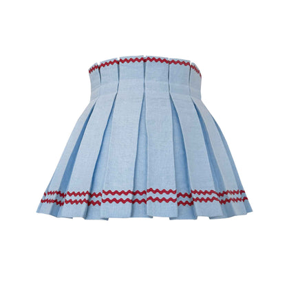 Light blue pleated lampskirt with red rick-rack trim at the top and double on the bottom.
